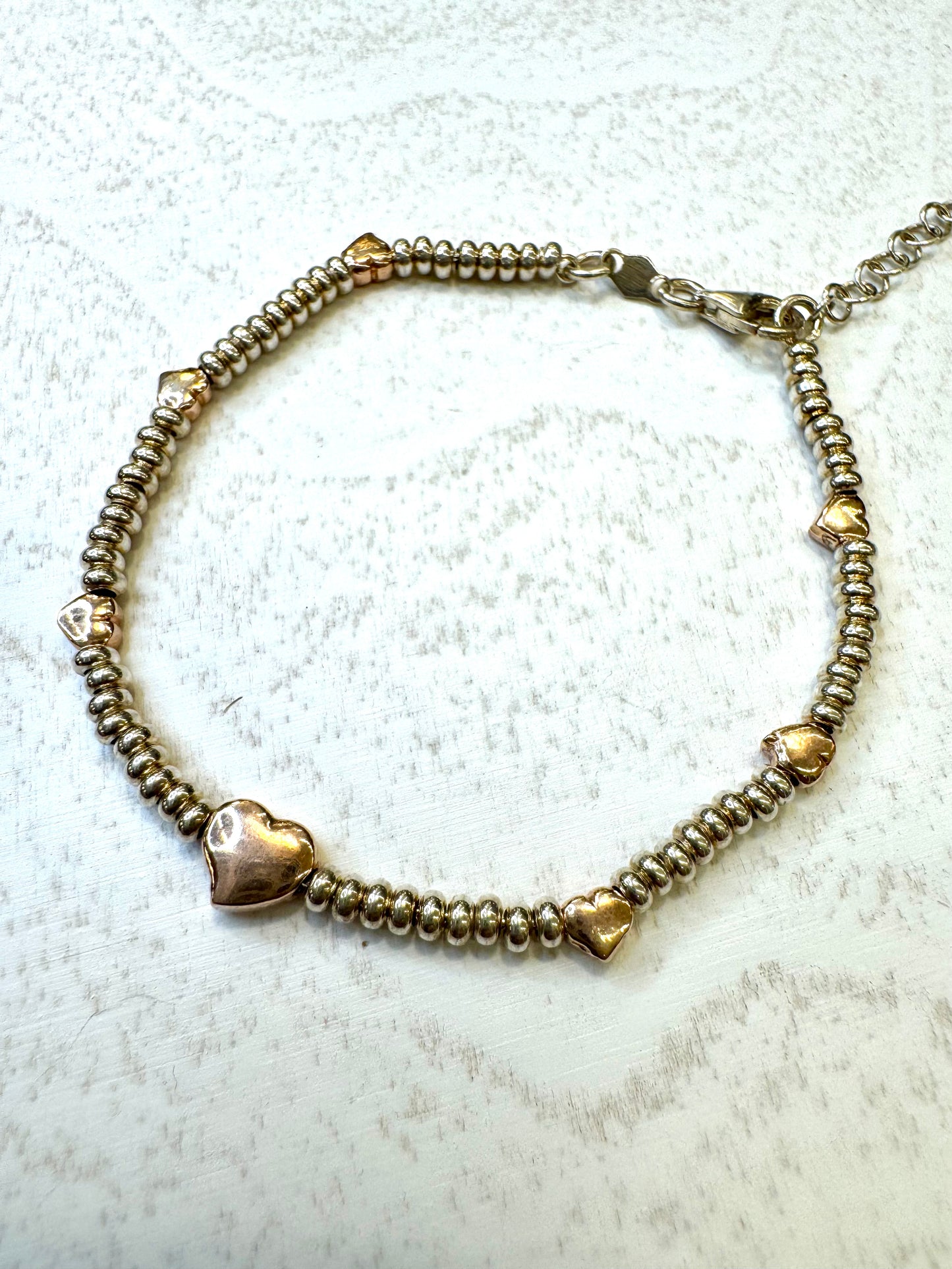 Bracciale in argento 925 con soggetti placcati in oro rosa